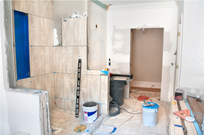 A master bathroom in the middle of a remodel with many unfinished features