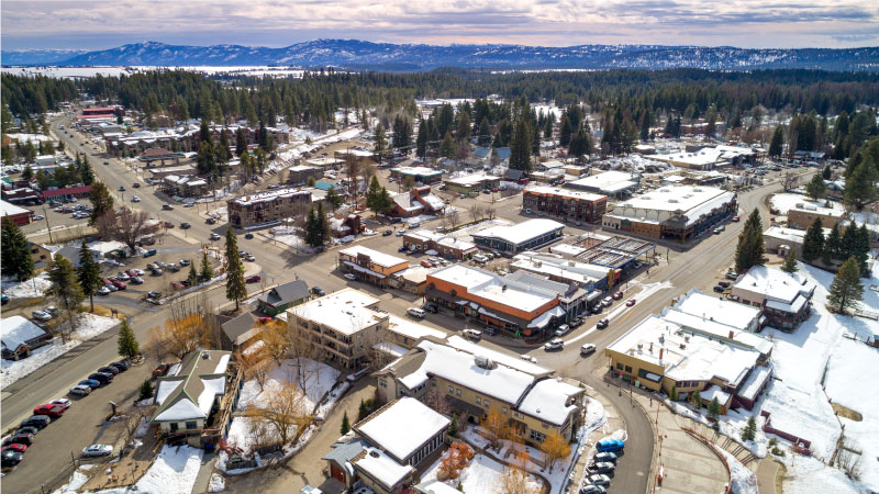 Aerial view of the small town of McCall, Idaho, in the winter with the mountains in the distance.