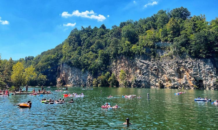 Locals swim at Mead’s Quarry Lake in Knoxville, Tennessee, on a sunny summer day.