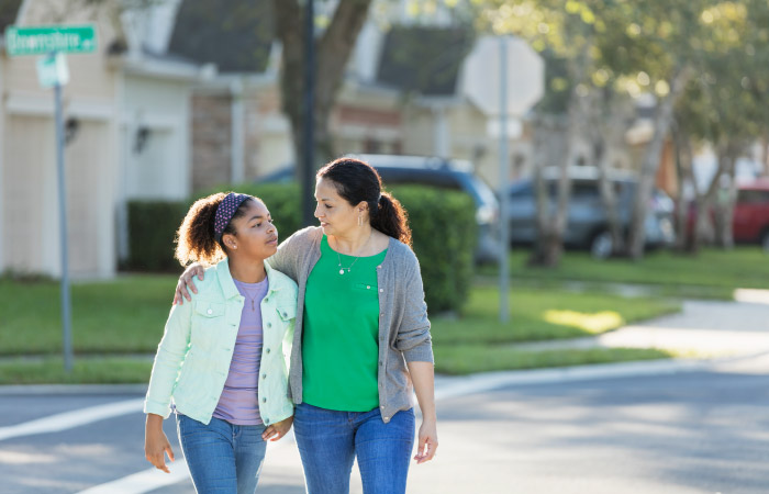 A mother and daughter are on a walk as they talk about their upcoming cross-country move.