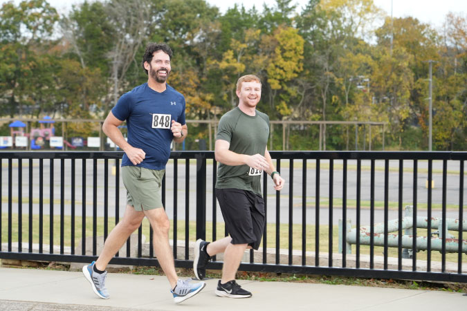 Two locals run through the city of Mount Juliet, Tennessee, during a local 5K race.