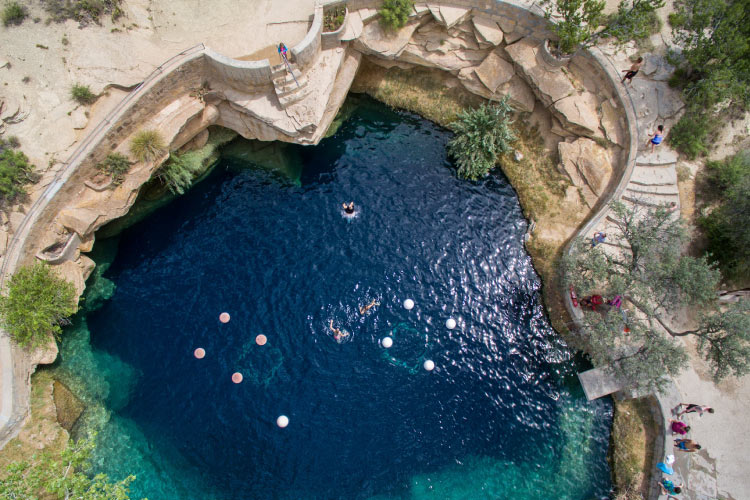 Bird’s-eye view of the “Blue Hole” swimming and diving locale in Santa Rosa, New Mexico. The hole is 80 feet deep and maintains a water temperature of 62 degrees. 