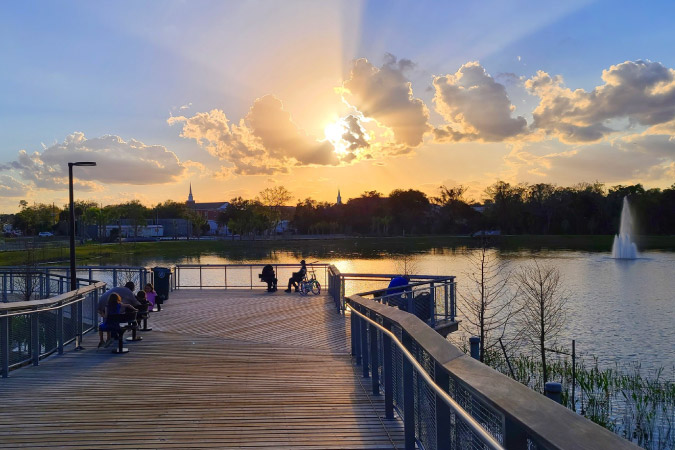 Sunset view over the water at Solary Park in Oviedo, Florida — one of the best Orlando suburbs