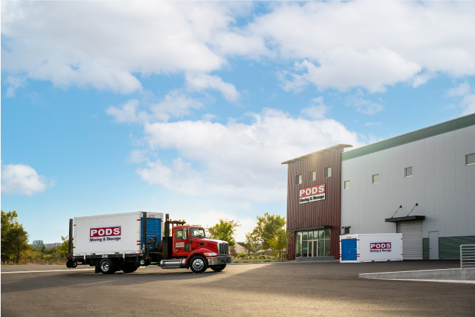 A loaded PODS truck approaches a secure PODS storage facility — one of over 240 in the nation.