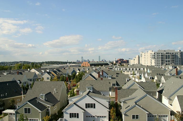 a view of rows of houses in a suburb of Boston