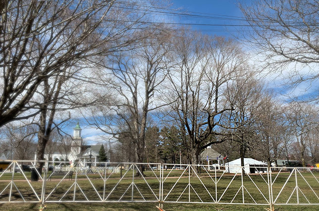 The Boston suburb of Hopkinton. There are acres of farm land with a home hidden among the bare trees.
