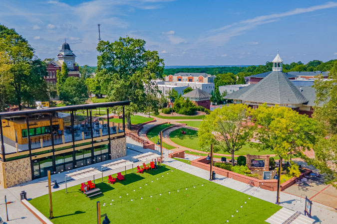 Aerial view of Downtown Duluth, Georgia, featuring greenspaces and City Hall