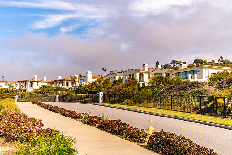Mediterranean-style homes lining a residential road in Torranca, California