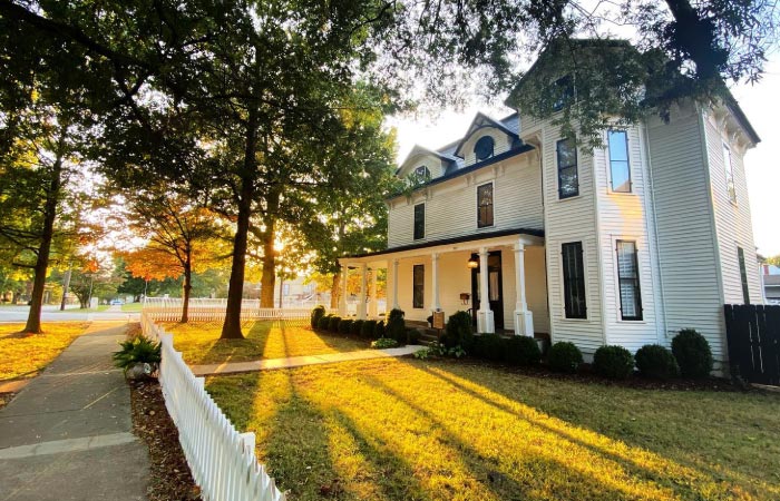 A large, historic home in Old Town Huntsville, Alabama, during the golden hour