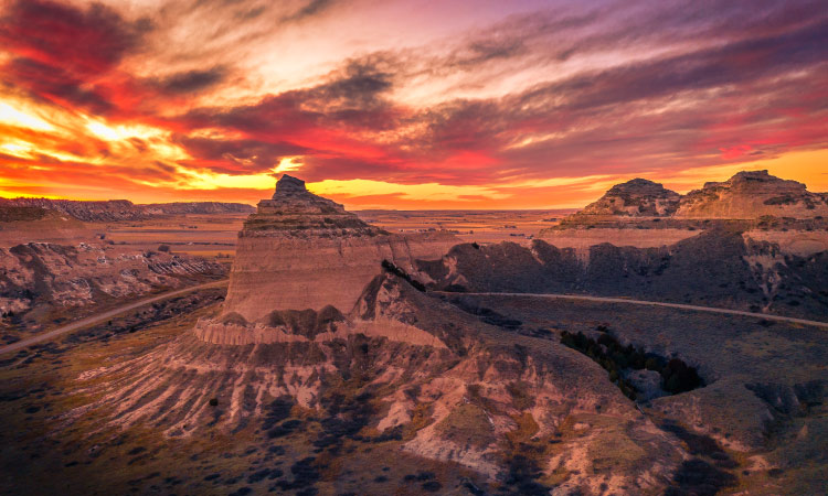 Aerial view of a sunset over Scotts Bluff National Monument in Gering, Nebraska.