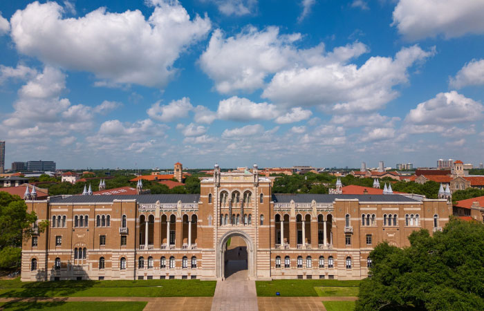 Aerial view of the impressive Rice University in Houston, Texas, under a vivid blue sky.