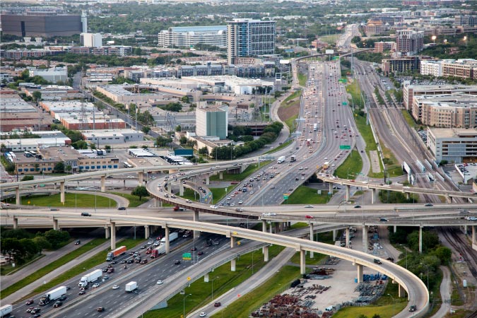 Aerial view of freeways in Dallas, Texas, featuring multiple overpasses