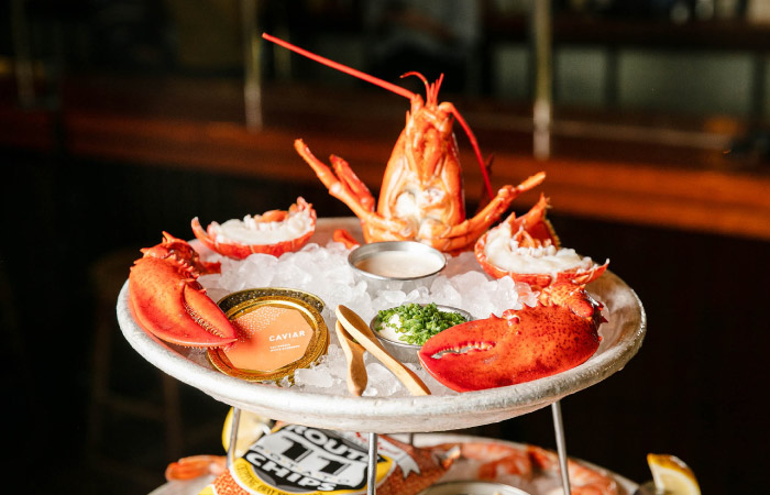 A delicious display of Maine Lobster and caviar arranged on a plate of ice chips at Old Ebbitt Grill in Washington, D.C.