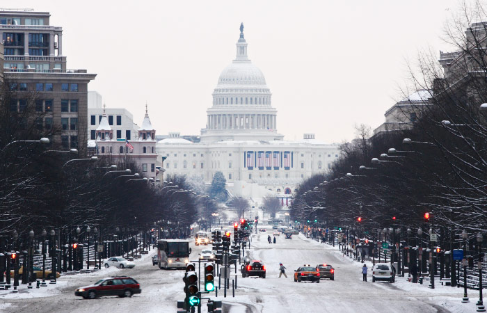 The view down an icy thoroughfare toward the U.S. Capitol on a snowy day in Washington, D.C.