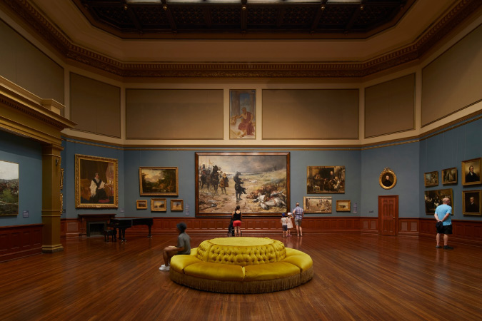 Visitors tour an elegant room in one of the Telfair Museums in Savannah, Georgia.