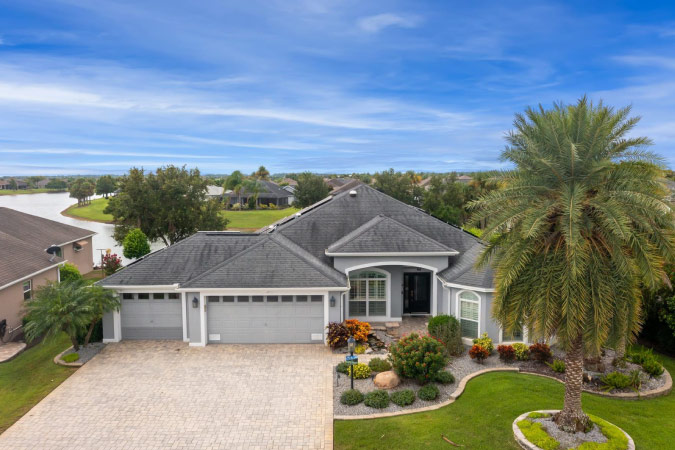 A home with an attached two-car garage located in the Village of Gilchrist, one of The Villages neighborhoods in Florida.