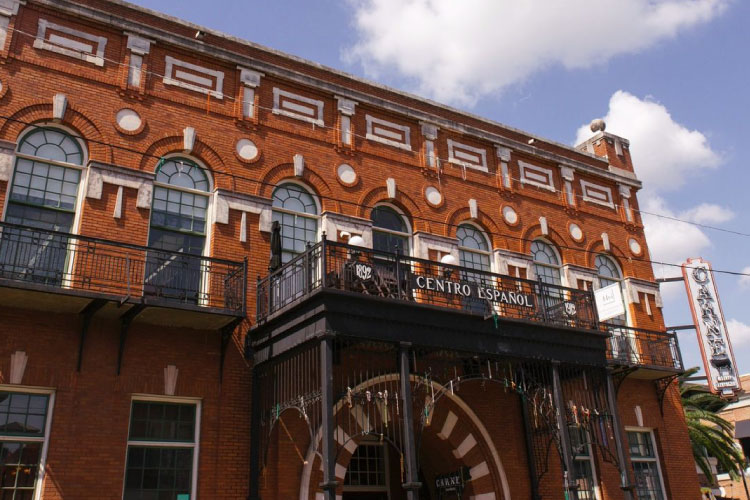 A brick building in Tampa’s Ybor City, featuring modern Spanish-style brick architecture. 