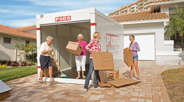 Family unloads PODS moving and storage container