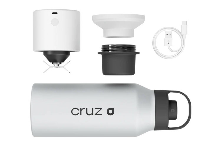 A Cruz bottle with a charger cable, blender lid, and funnel attachment.