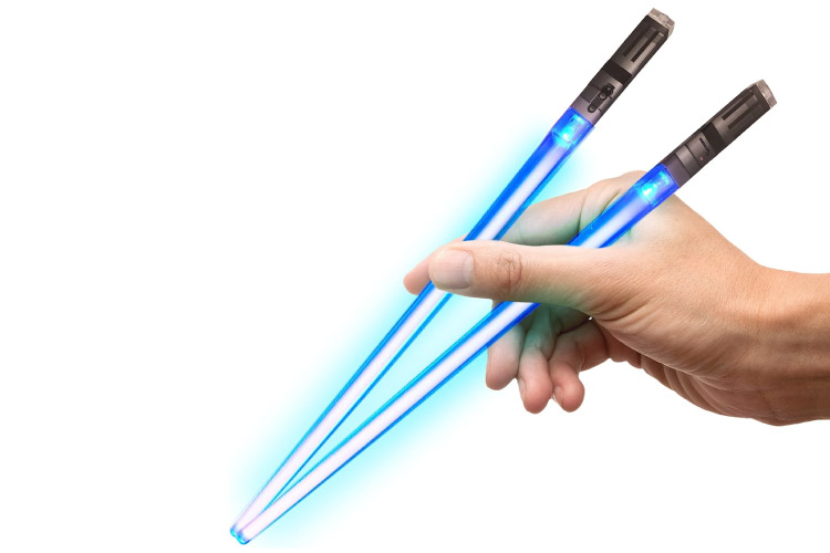 Close-up of a hand holding blue Lightsaber Chopsticks.
