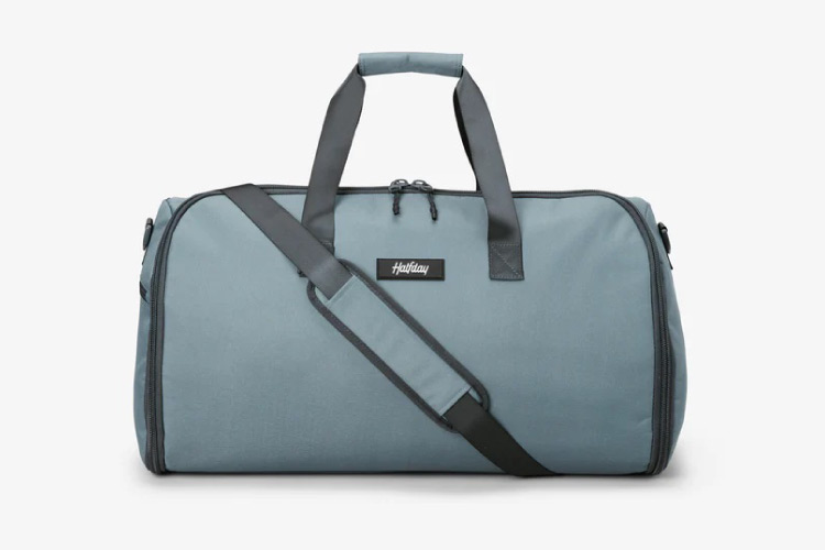 A blue Halfday Garment Duffel bag set against a white background.