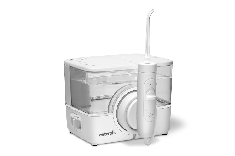 A white Waterpik Flosser is set against an all-white background.