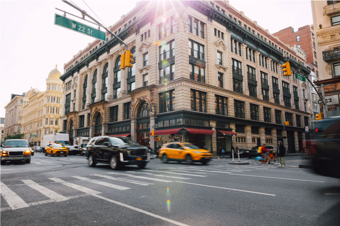 A busy intersection in NYC’s Chelsea neighborhood on a sunny winter afternoon.