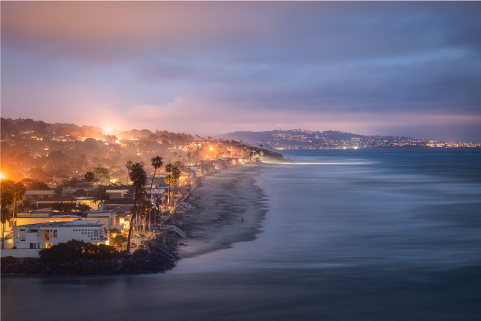 Aerial nighttime view of the coast in Del Mar, California — one of the best cities near San Diego.