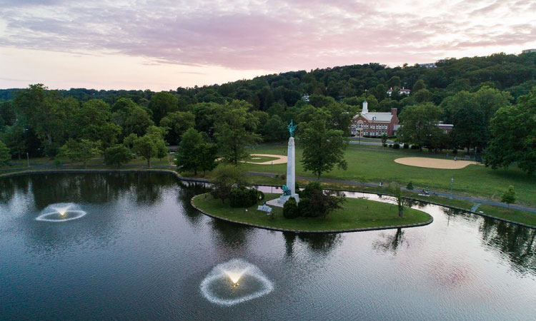 Aerial view of Edgemont Park in Montclair, New Jersey. The park features a pond with fountains and a WWI memorial.