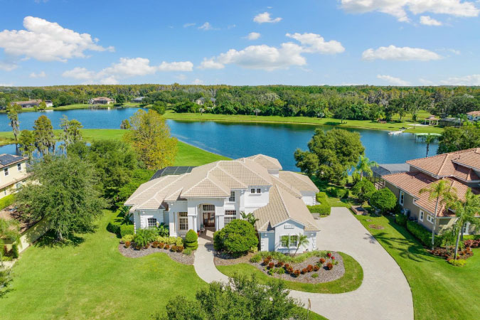 Aerial view of a lakeside wooded community in Odessa, Florida, outside of Tampa.