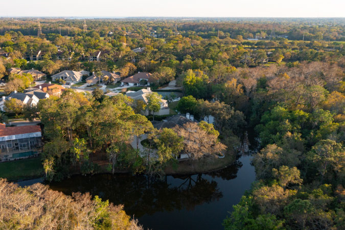 Aerial view of a residential neighborhood with waterfront homes in Oldsmar, Florida.