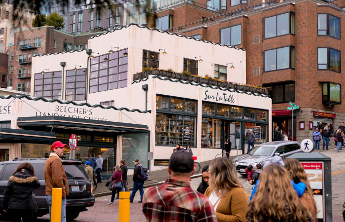 Locals and tourists explore Pike Place Market in Seattle, Washington.