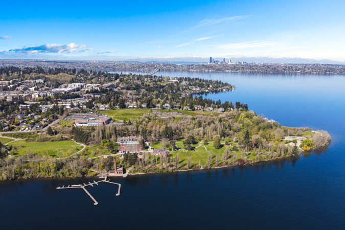 Aerial view of Mercer Island with downtown Seattle and Mount Rainier in the distance. 