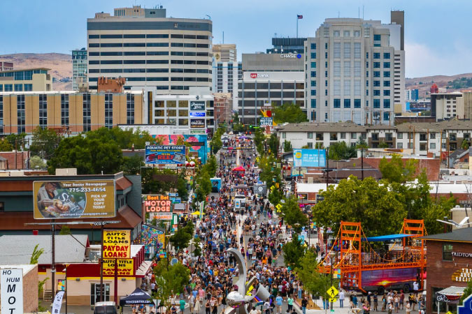 View down a crowded thoroughfare in Reno’s MidTown neighborhood during the annual Dancing in the Streets event.
