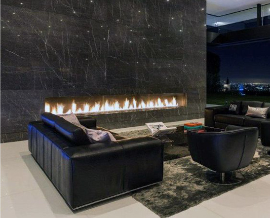 A modern, black fireplace built directly into the wall