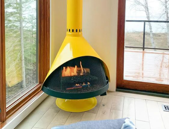 Mid-century modern fireplaces are ideal for adding a dose of MCM charm to your living area — and, if you opt for a punchy freestanding version, a dose of color, too.