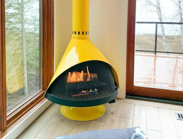 Mid-century modern fireplaces are ideal for adding a dose of MCM charm to your living area — and, if you opt for a punchy freestanding version, a dose of color, too. 