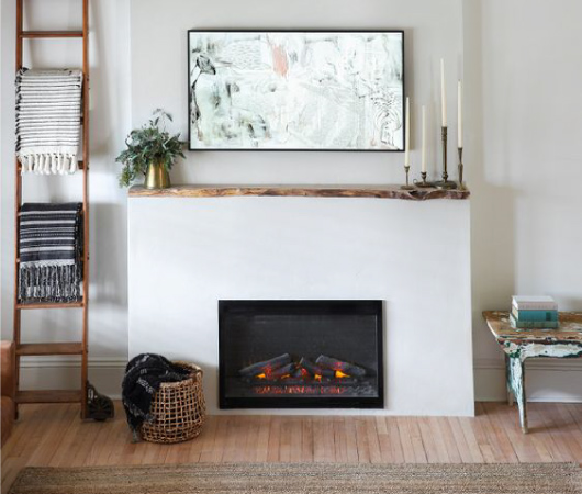 If you want the warmth of a hearth but don’t want it to be a bold focal point, you may want to go for a minimalist fireplace.