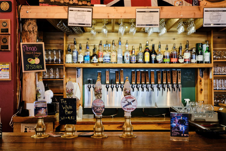 The bar at Santiam Brewing Co. in Salem, Oregon, features an array of beers on tap as well as a variety of spirits above the bar.