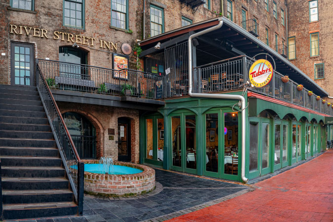 The front of the historic River Street Inn in Savannah, Georgia, during the day.