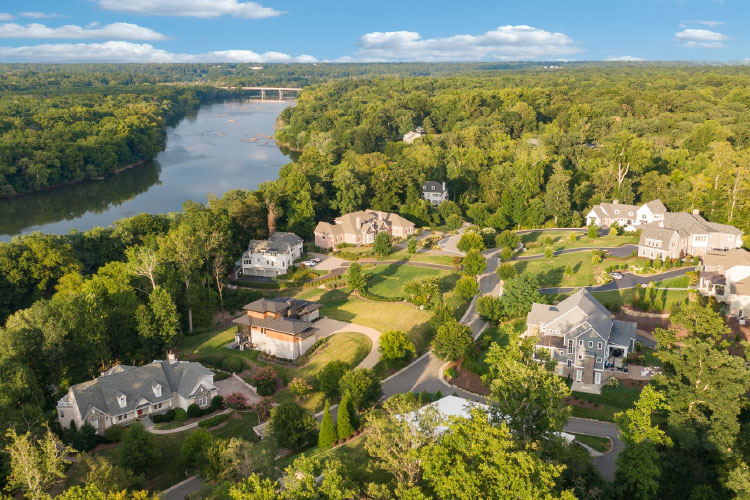 Aerial view of Bon Air, a census-designated place in Virginia. The community features large luxury homes amidst a lush forest