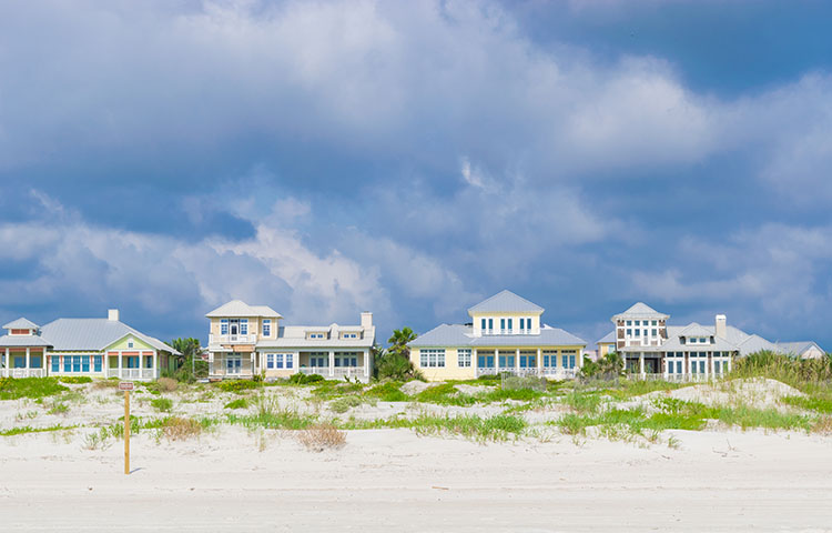 Beach homes lined along St. Augustine Beach on a cloudy day