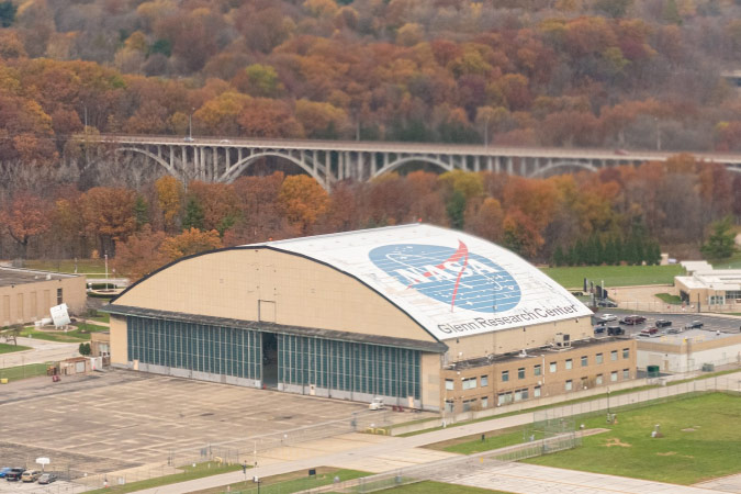 Exterior view of NASA’s Glenn Research Center in Cleveland’s Riverside neighborhood, surrounded by autumn foliage.