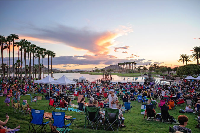 Residents of Goodyear, Arizona, enjoy a community event by the water.