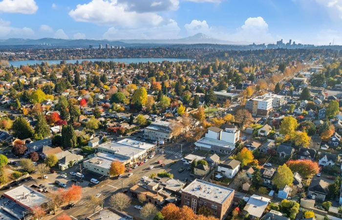 Aerial view of Seattle’s Phinney Ridge neighborhood with Downtown Seattle and Mt. Rainier visible in the distance. 
