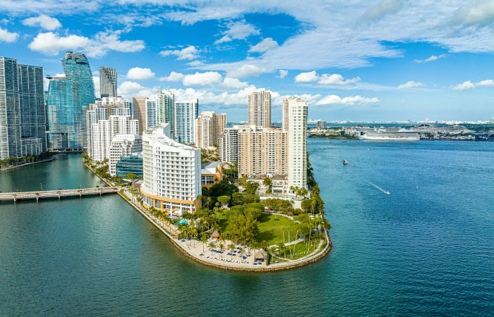 Aerial view of Brickell Key — part of Miami’s Brickell neighborhood — on a sunny day.