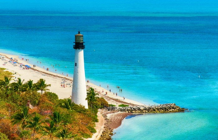 Aerial view of the beautiful Cape Florida Lighthouse at the end of the Robin’s Birding Trail in Key Biscayne, Florida.