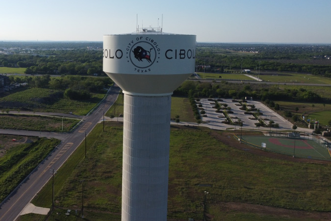 View of the Cibolo, Texas, water tower and surrounding fields and residential developments outside of San Antonio, Texas. 