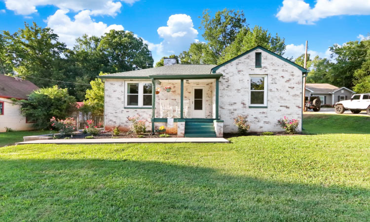 A small, brick single-family home in the South Knoxville neighborhood in Knoxville, Tennessee