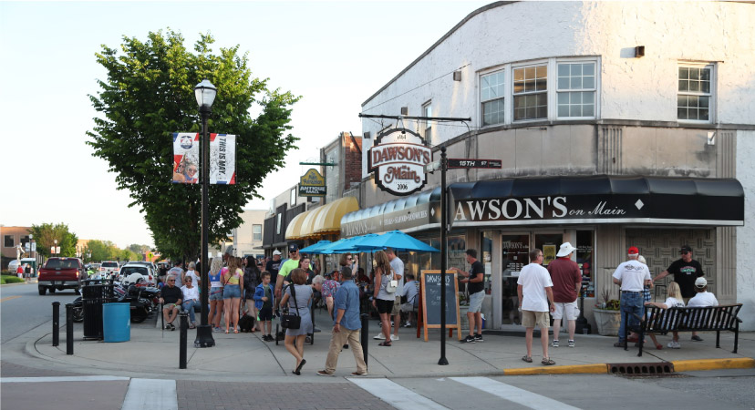 Locals and tourists alike are strolling along Main Street in Speedway, Indiana, past local hot spots like Dawson’s on Main.